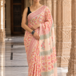Soft Mulmul Cotton Saree in Pastel Peach with Floral Prints & Elegant Decorative Border